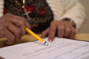 Student holds pencil to paper during exam